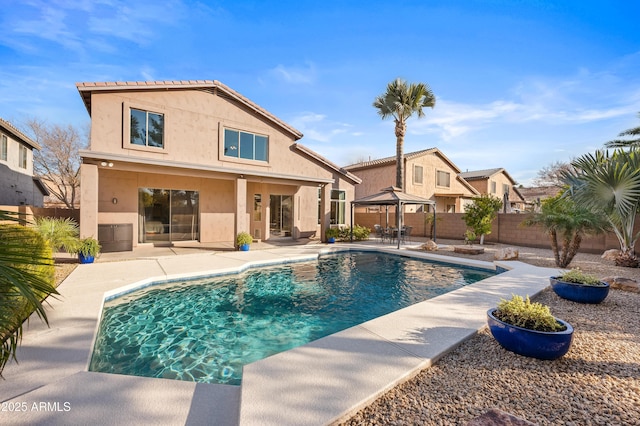 view of swimming pool featuring a gazebo and a patio area