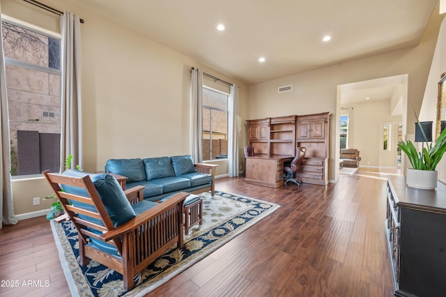 living room featuring dark hardwood / wood-style flooring