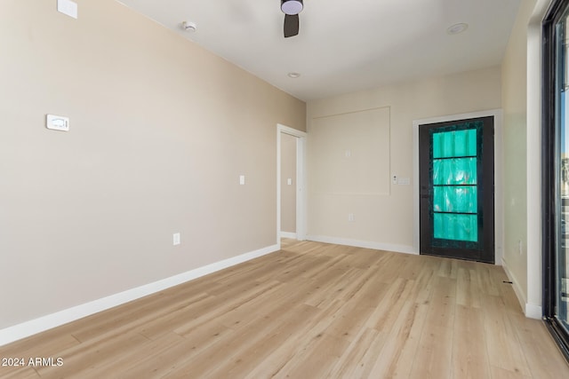 empty room with light hardwood / wood-style floors and ceiling fan