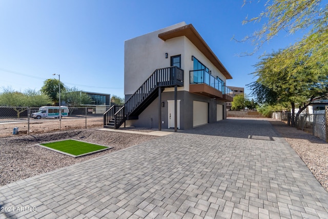 view of side of home with a garage