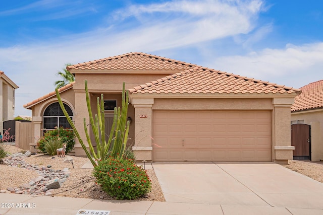 15827 S 12th Pl, Phoenix, AZ 85048 - mediterranean / spanish-style home with driveway, an attached garage, a gate, and stucco siding