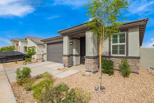 view of front of home featuring concrete driveway, stone siding, a garage, and stucco siding