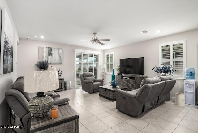 living room featuring light tile patterned flooring, ceiling fan, and recessed lighting
