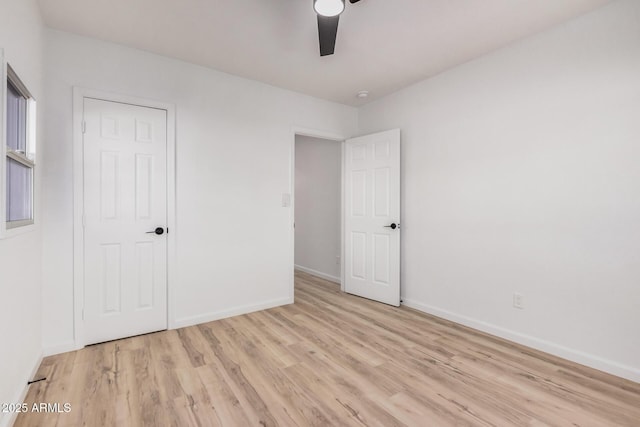 11025 E Cholla Rd, Mesa, AZ 85207 - unfurnished bedroom with light wood-style flooring, baseboards, and ceiling fan