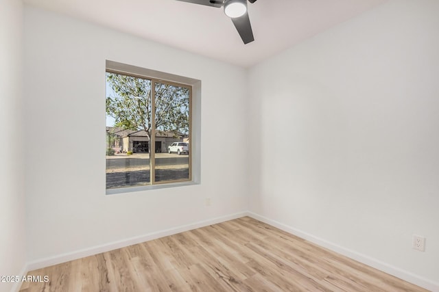 11025 E Cholla Rd, Mesa, AZ 85207 - spare room featuring wood finished floors, baseboards, and a ceiling fan