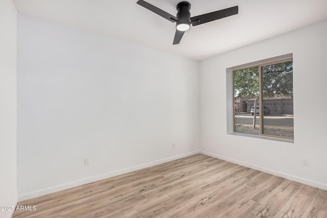 11025 E Cholla Rd, Mesa, AZ 85207 - empty room featuring wood finished floors, baseboards, and a ceiling fan