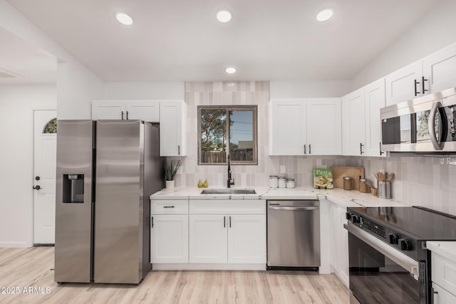 11025 E Cholla Rd, Mesa, AZ 85207 - kitchen featuring appliances with stainless steel finishes, a sink, light stone countertops, tasteful backsplash, and recessed lighting