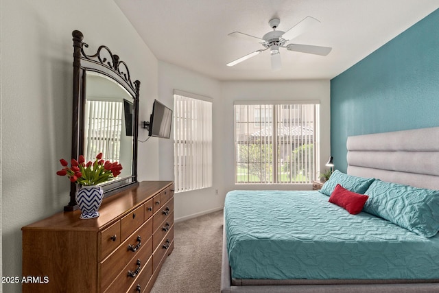 bedroom with carpet floors, baseboards, and ceiling fan