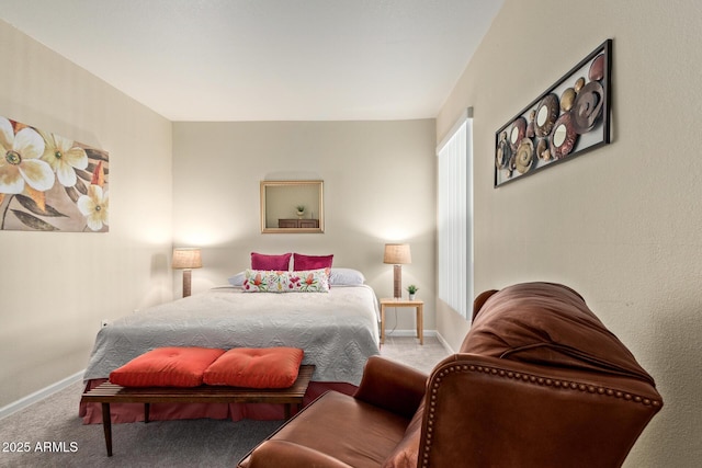 bedroom featuring carpet floors and baseboards