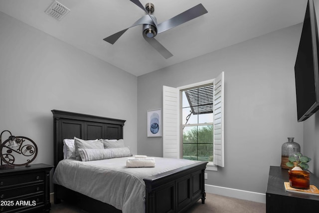 bedroom featuring ceiling fan and dark carpet