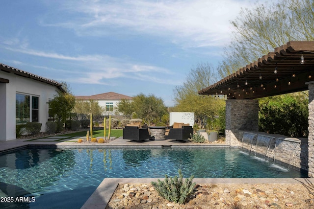 view of pool featuring a patio area, an outdoor hangout area, and pool water feature