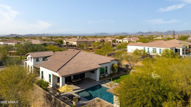 birds eye view of property featuring a mountain view