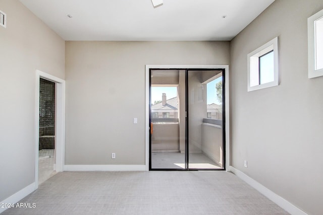 unfurnished room featuring a wealth of natural light