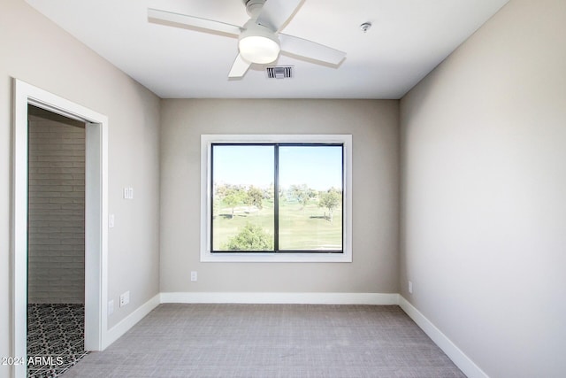 spare room with ceiling fan