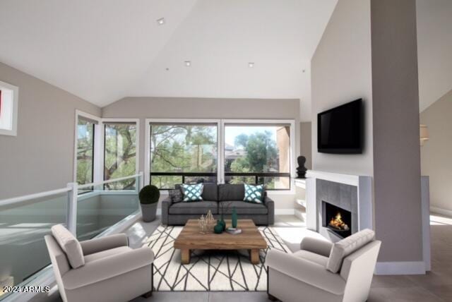 living room with high vaulted ceiling