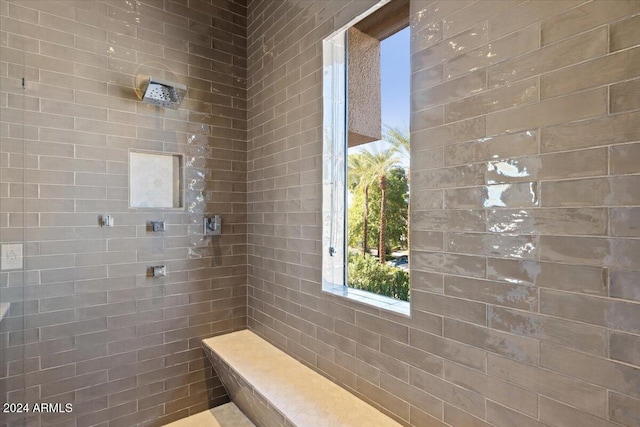 bathroom featuring tiled shower