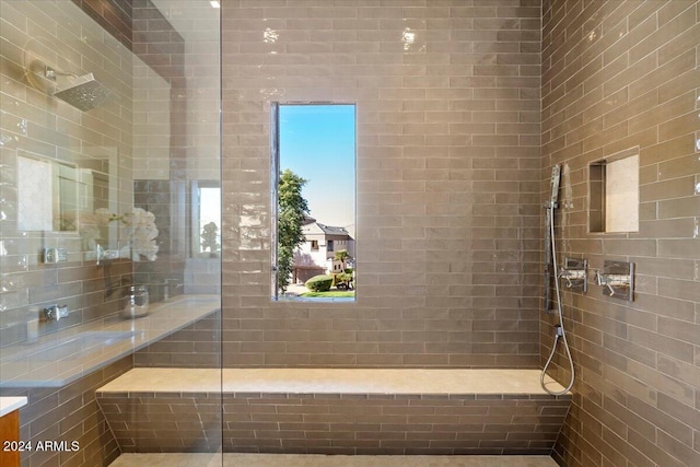 bathroom with tiled shower