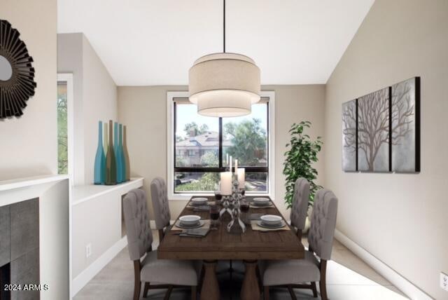 dining area featuring vaulted ceiling