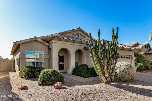 mediterranean / spanish-style house featuring a garage