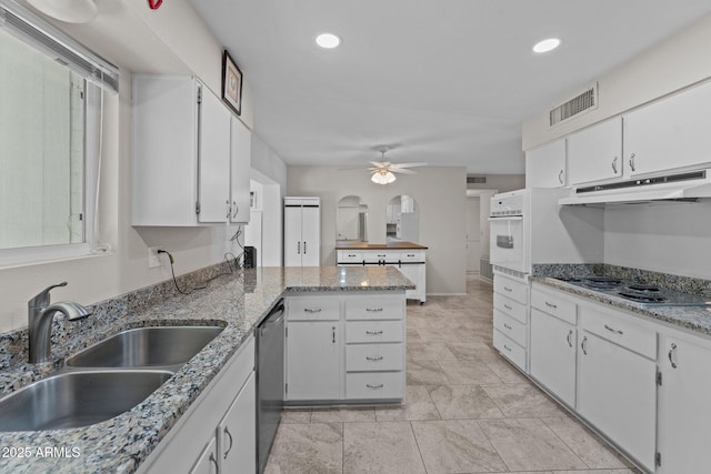 kitchen featuring dishwasher, white cabinetry, electric stovetop, sink, and white oven