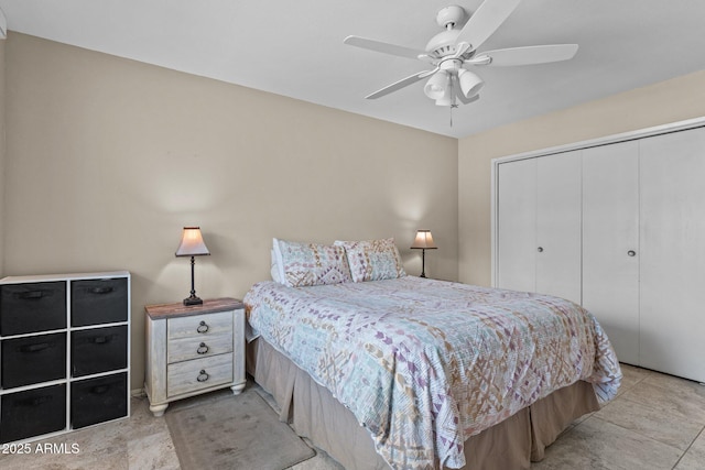 bedroom featuring ceiling fan and a closet