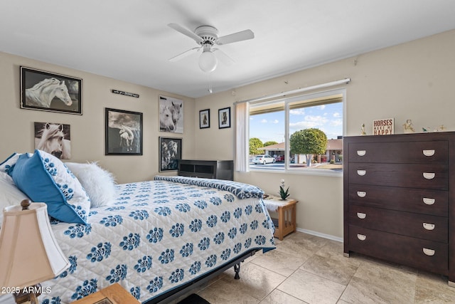 bedroom featuring ceiling fan and light tile patterned floors