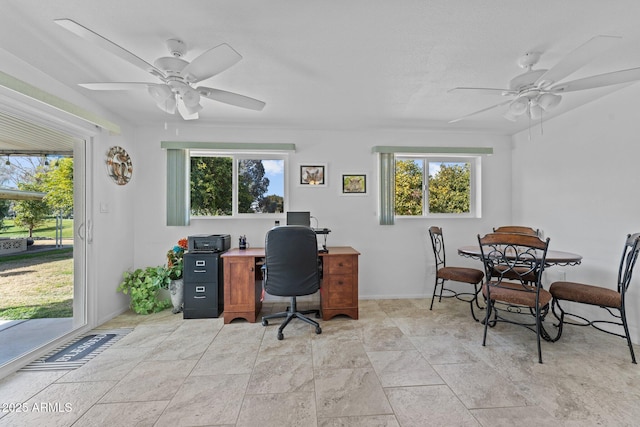 office area featuring plenty of natural light and ceiling fan