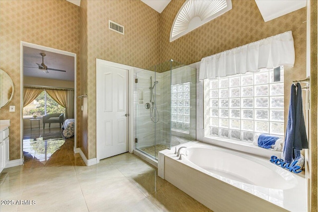 bathroom with independent shower and bath, tile patterned floors, and vanity