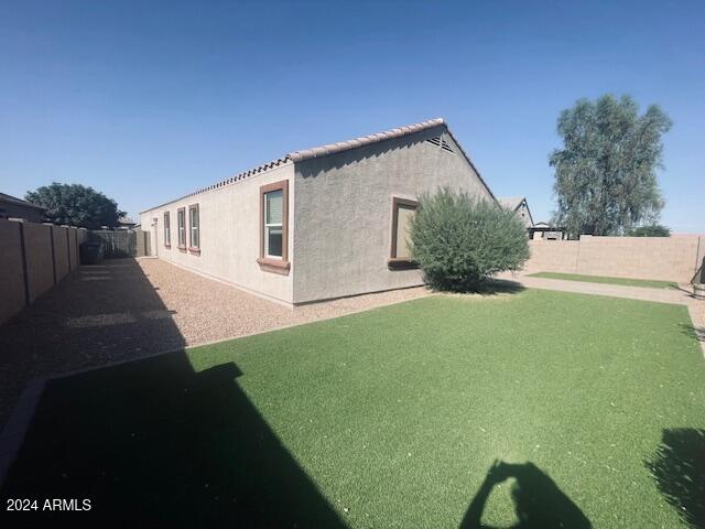 view of home's exterior featuring a lawn