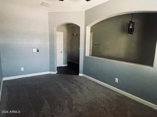 carpeted empty room with ceiling fan