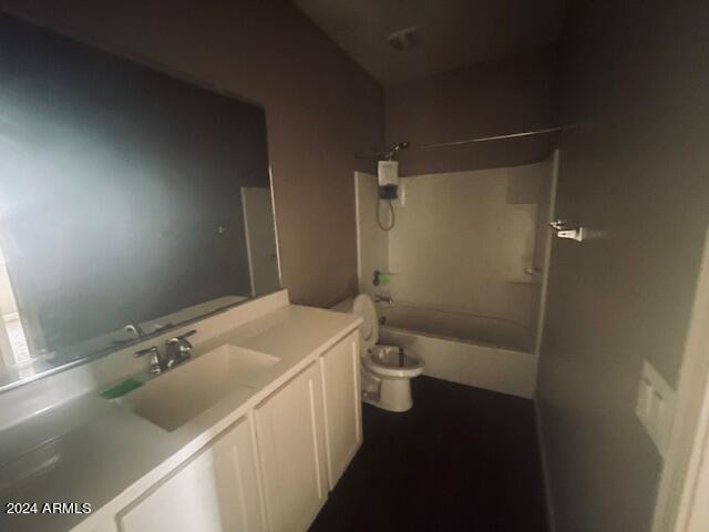 full bathroom with tub / shower combination, vanity, and toilet