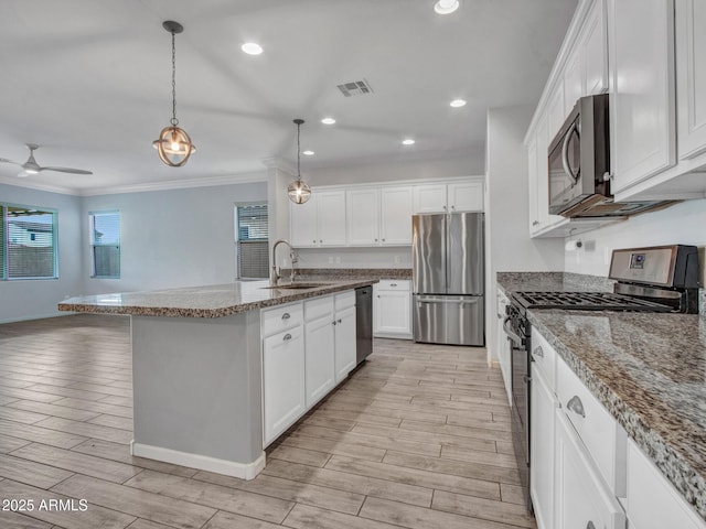 kitchen featuring wood tiled floor, visible vents, stainless steel appliances, and a sink