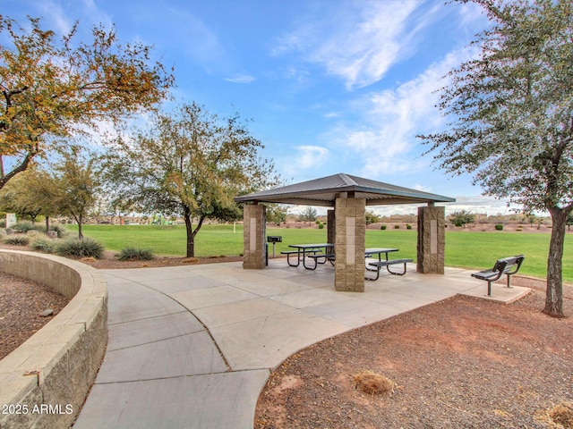 surrounding community with a patio area, a yard, and a gazebo