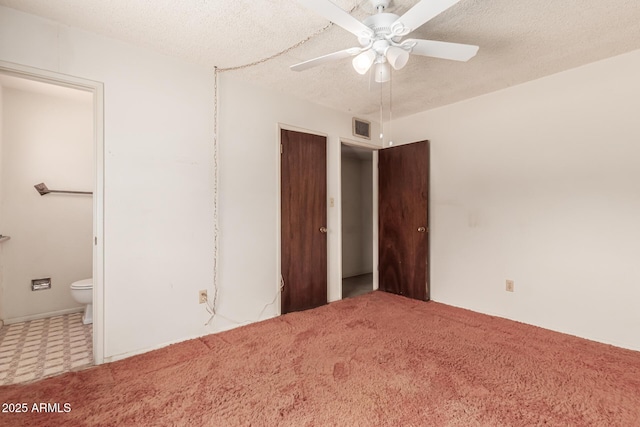 4343 E Union Hills Dr, Phoenix, AZ 85050 - unfurnished bedroom featuring ensuite bath, visible vents, carpet, and a textured ceiling