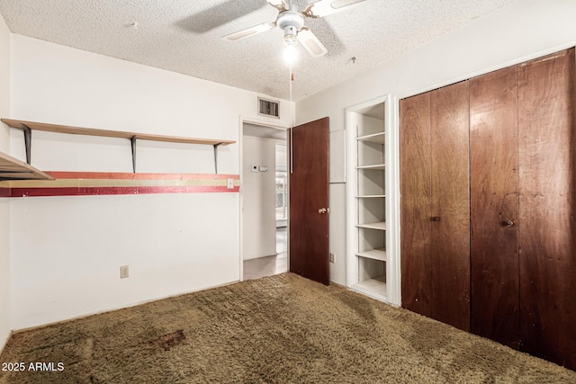 4343 E Union Hills Dr, Phoenix, AZ 85050 - unfurnished bedroom with visible vents, a closet, carpet, and a textured ceiling