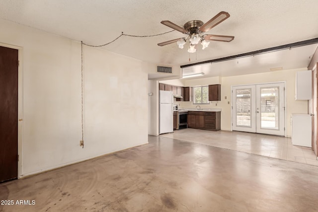 4343 E Union Hills Dr, Phoenix, AZ 85050 - unfurnished living room featuring finished concrete flooring, a textured ceiling, a ceiling fan, visible vents, and a sink