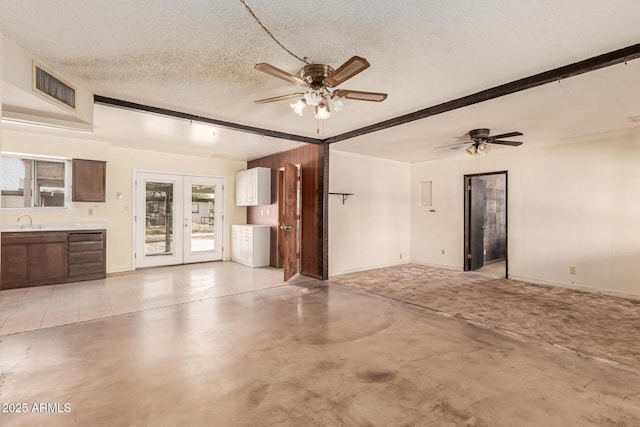 4343 E Union Hills Dr, Phoenix, AZ 85050 - unfurnished living room featuring french doors, ceiling fan, visible vents, and concrete flooring