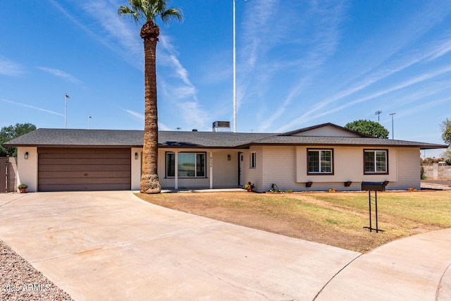 8124 N 45th Ave, Glendale, AZ 85302 - ranch-style house featuring driveway, an attached garage, and a front lawn