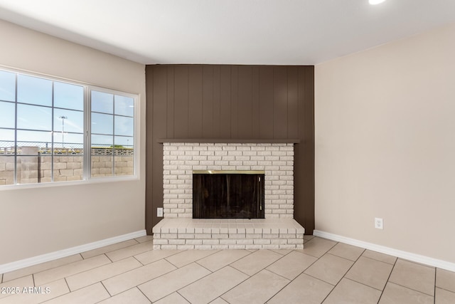 8124 N 45th Ave, Glendale, AZ 85302 - unfurnished living room with tile patterned flooring, baseboards, and a brick fireplace