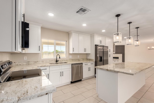 8124 N 45th Ave, Glendale, AZ 85302 - kitchen with appliances with stainless steel finishes, a sink, light stone counters, light tile patterned flooring, and recessed lighting