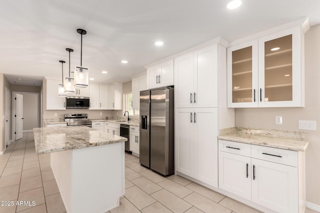 8124 N 45th Ave, Glendale, AZ 85302 - kitchen featuring stainless steel appliances, a sink, white cabinetry, recessed lighting, and a kitchen island