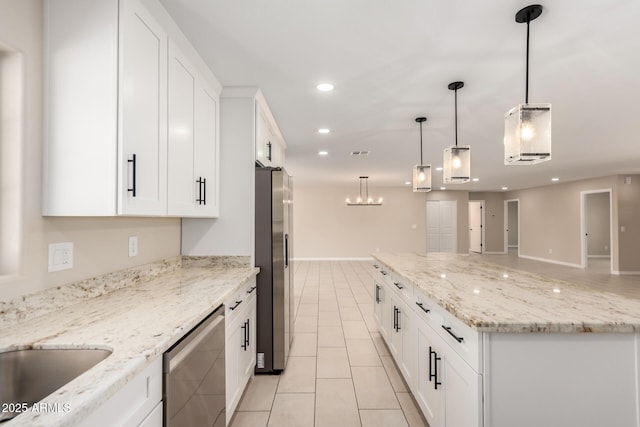 8124 N 45th Ave, Glendale, AZ 85302 - kitchen featuring appliances with stainless steel finishes, light tile patterned flooring, recessed lighting, white cabinetry, and a center island