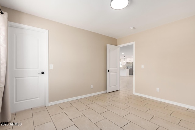 8124 N 45th Ave, Glendale, AZ 85302 - unfurnished room featuring baseboards, a smoke detector, and light tile patterned floors