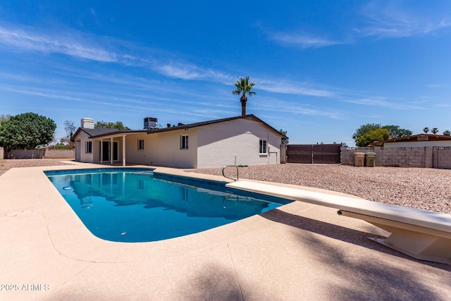 8124 N 45th Ave, Glendale, AZ 85302 - view of pool featuring a patio, a diving board, and a fenced backyard