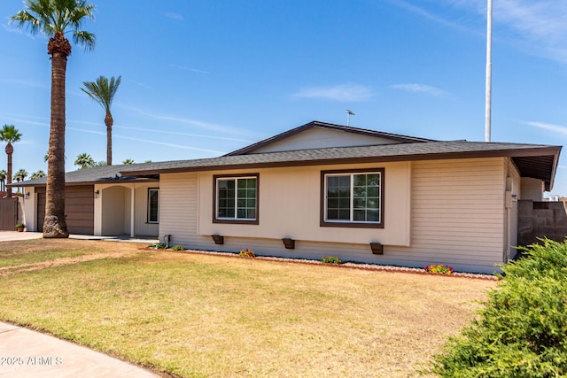 8124 N 45th Ave, Glendale, AZ 85302 - ranch-style house with an attached garage, roof with shingles, and driveway