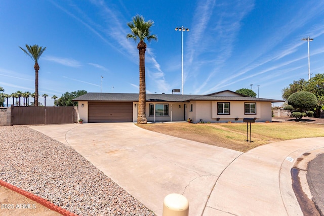 8124 N 45th Ave, Glendale, AZ 85302 - ranch-style home featuring a garage and driveway