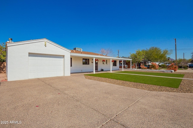 ranch-style house with a porch, stucco siding, concrete driveway, a front lawn, and a garage