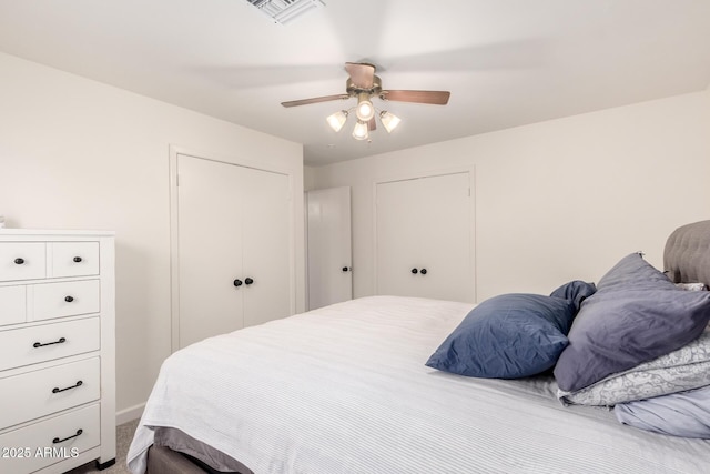 bedroom with visible vents, a ceiling fan, and carpet