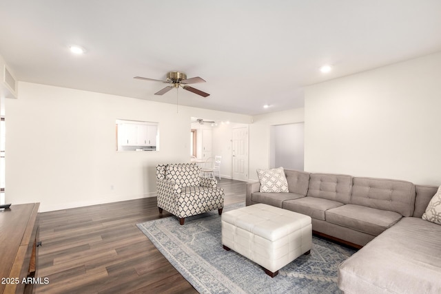 living room featuring dark wood-type flooring, recessed lighting, baseboards, and ceiling fan