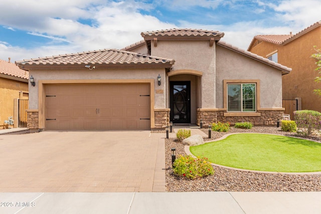 10738 W Rowel Rd, Peoria, AZ 85383 - mediterranean / spanish house with driveway, stone siding, a garage, and stucco siding